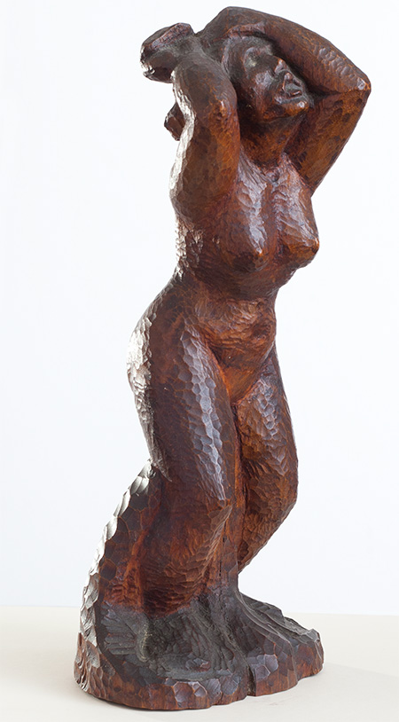 A full figure of a naked woman, hands raised above her head looks upwards to the sky. Her mouth is open as if in distress. Her whole body rises upwards and is taut with anguish.